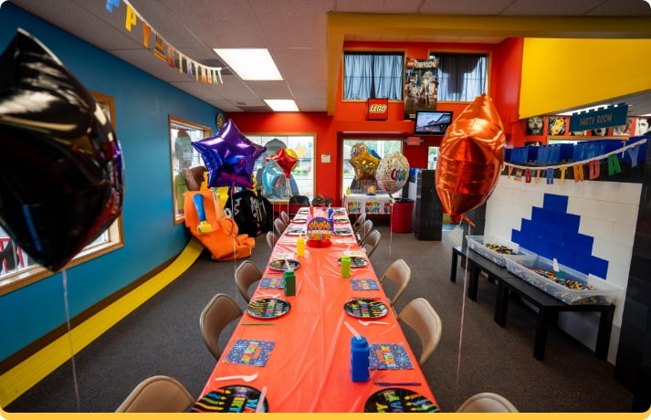 birthday party room with toys and party decorations