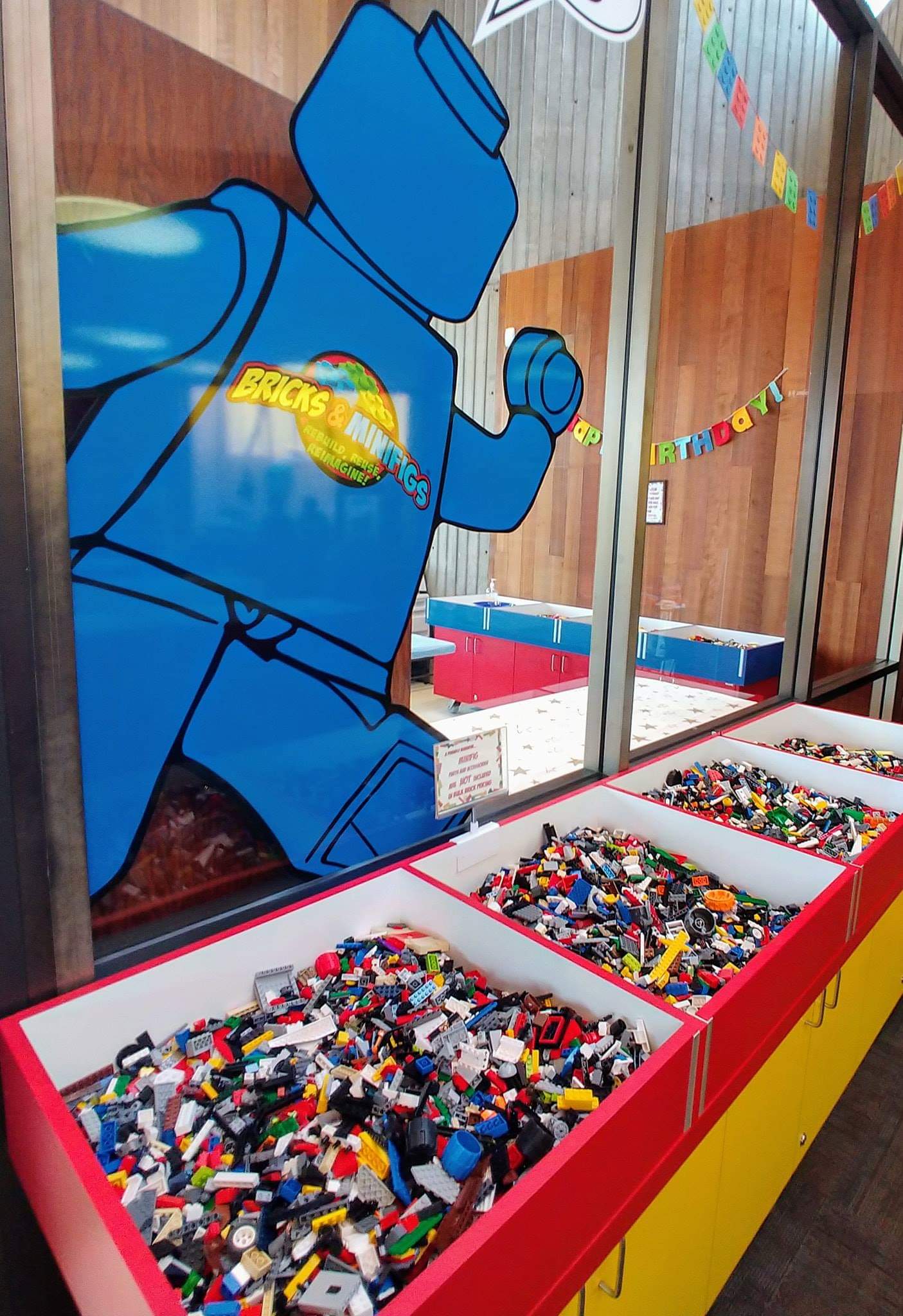 Loose Legos in multiple bins.