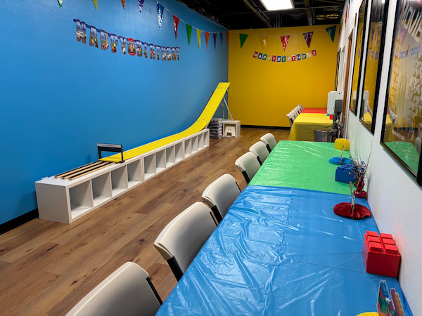 alternate view of party room showing the 18-foot long LEGO® derby car race track