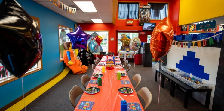 birthday party room with toys and party decorations