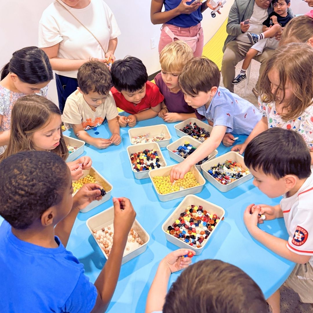 close up several people holding mini figurines