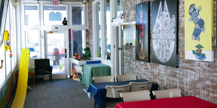 party setup birthday party room showing tables, decor, and derby race track