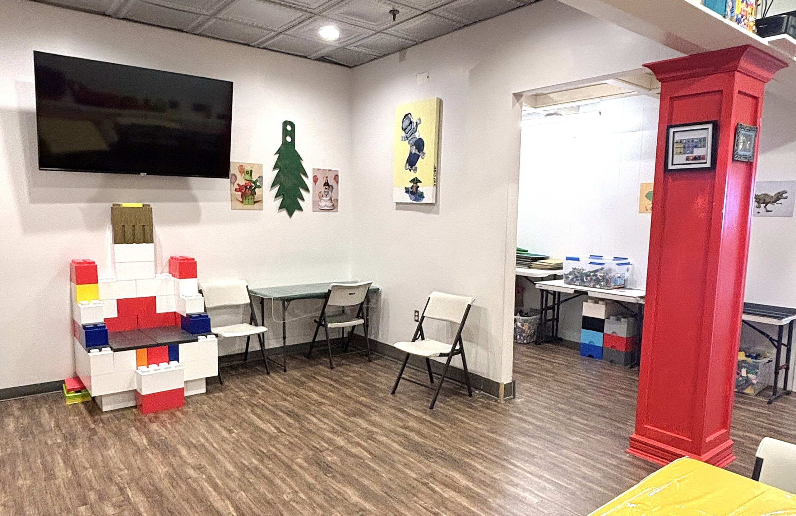 birthday party room showing tables, decor, and derby race track