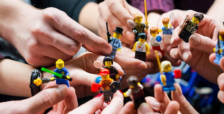 hands-holding-minifigs-event