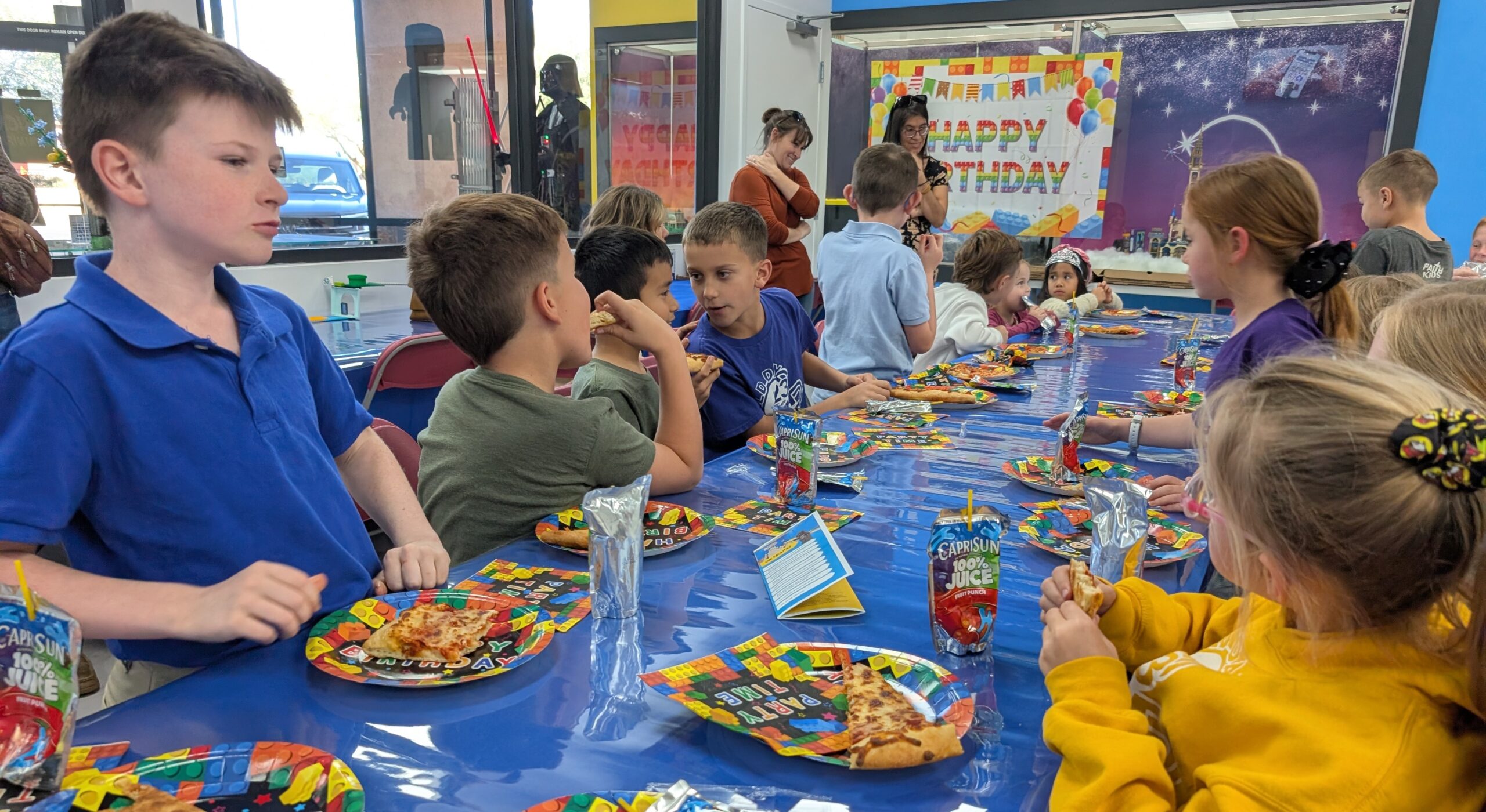 birthday party room with toys and party decorations