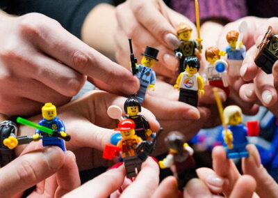 hands holding minifigures