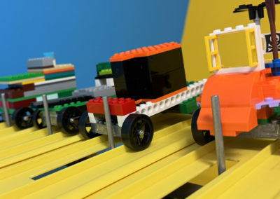 Lego Built Race cars, ready to go down a track