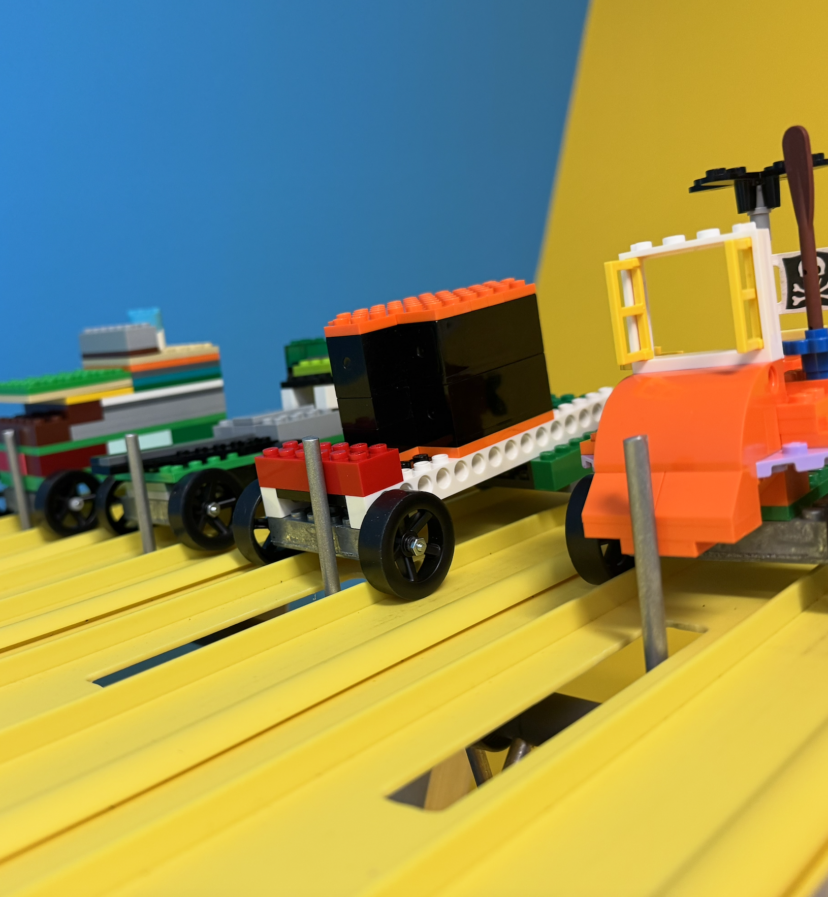 Lego Built Race cars, ready to go down a track