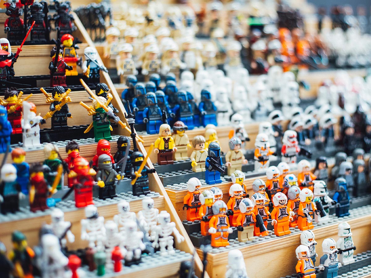 Shallow focus photography of LEGO® minifigure collection on a stand.
