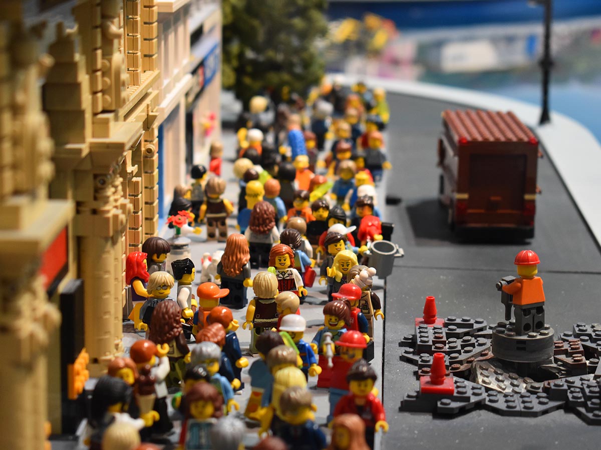 Urban city scene created with LEGOs with a large collection of minifigures.