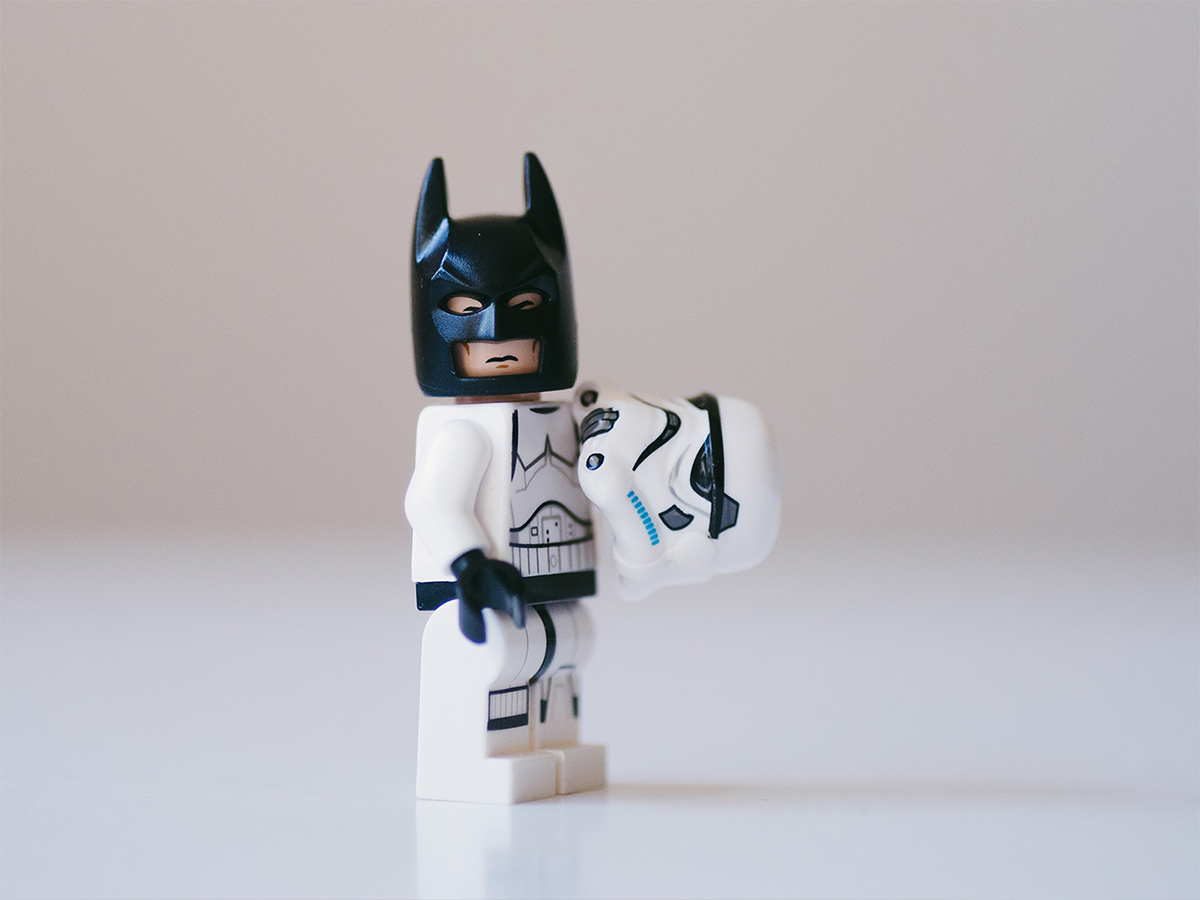 LEGO® Batman minifigure with a white suit and black mask.
