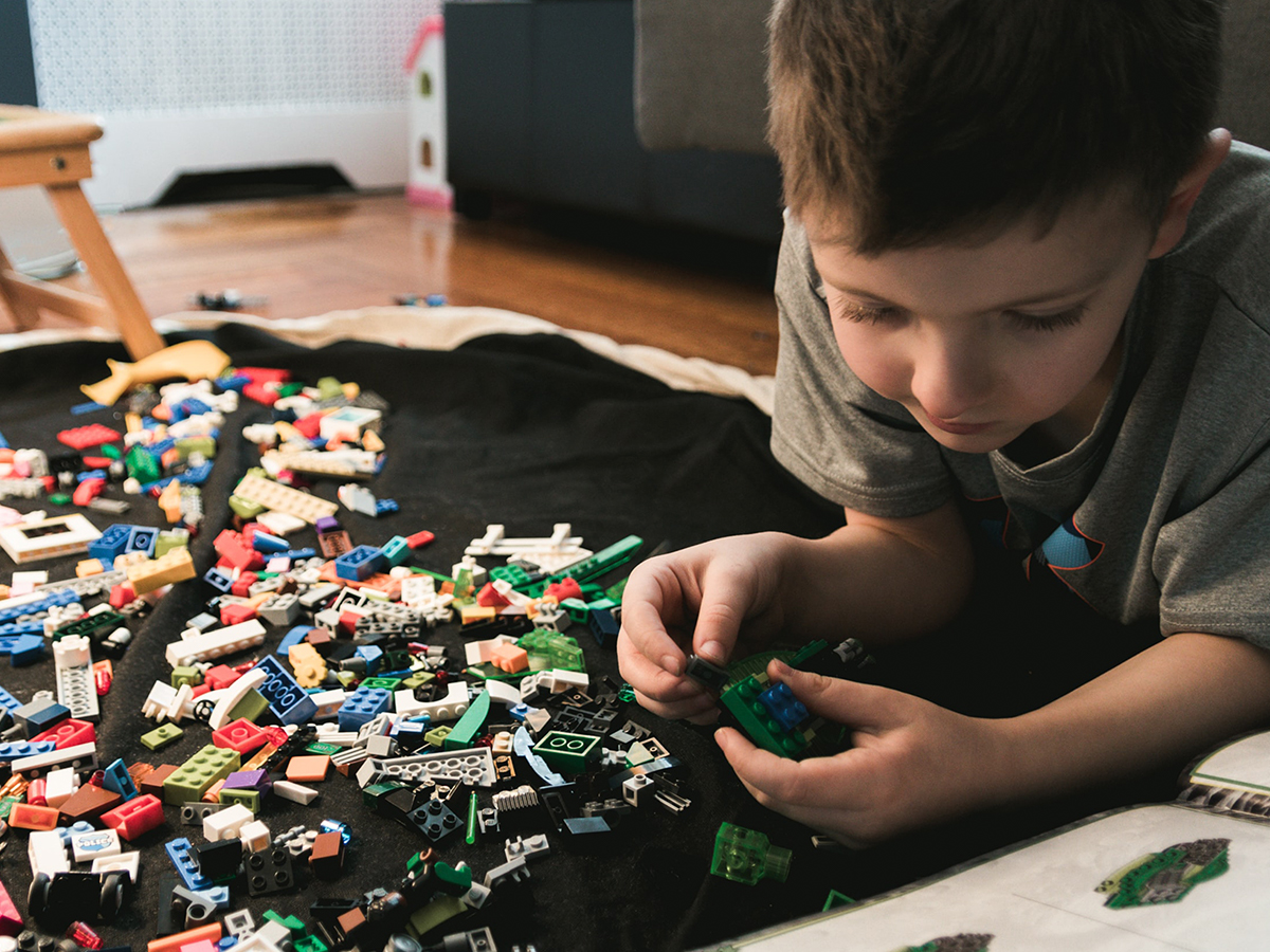 child playing with legos
