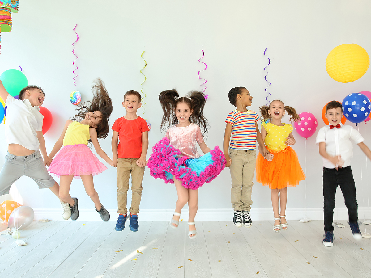 Children jumping at birthday party