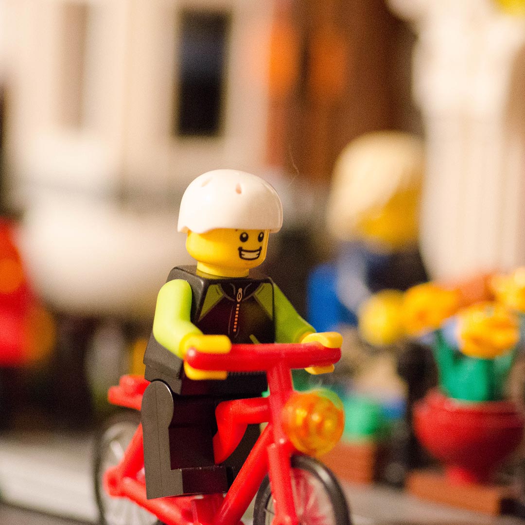 Lego figurine on a bicycle