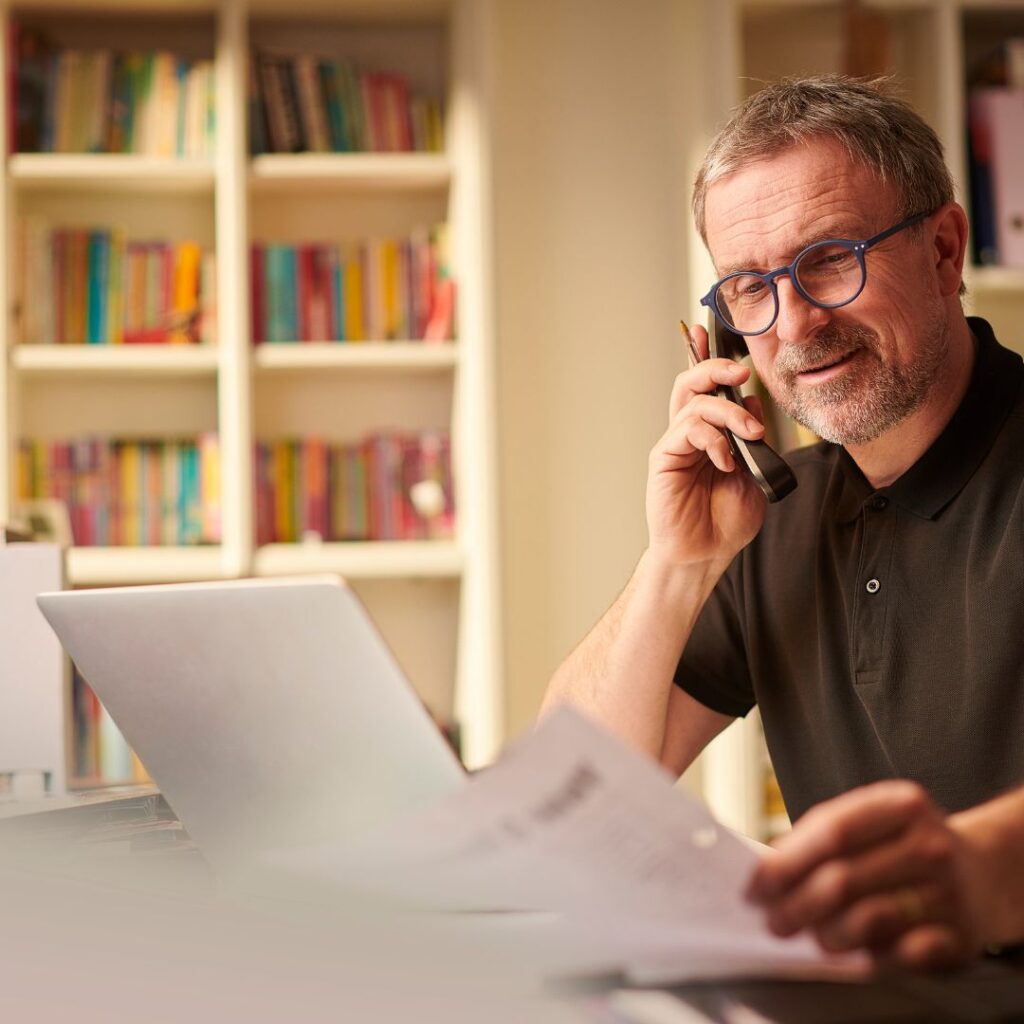 man looking over documents