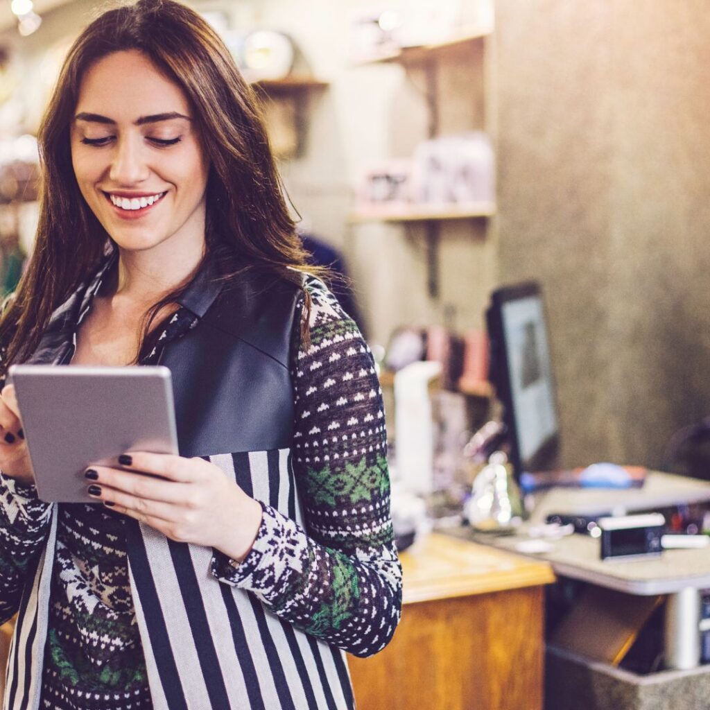 woman looking at tablet