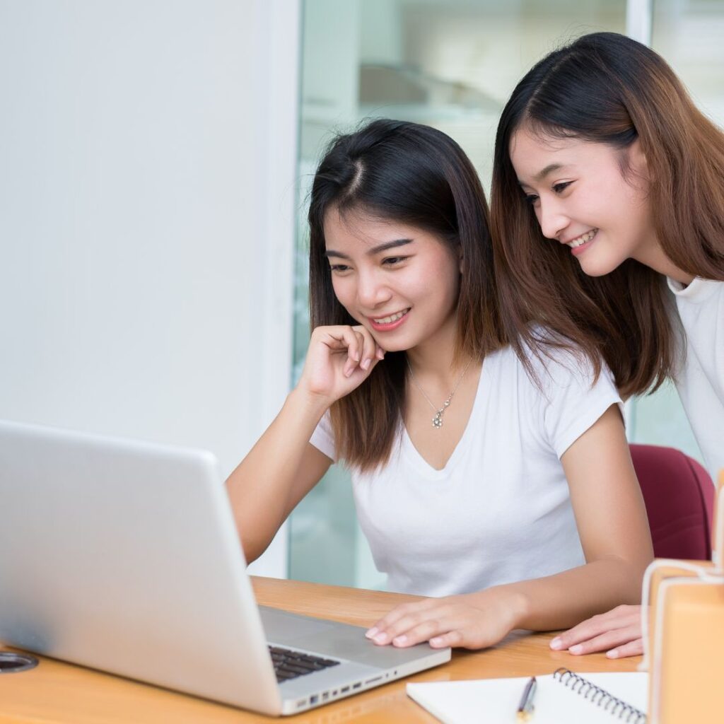 women looking at computer