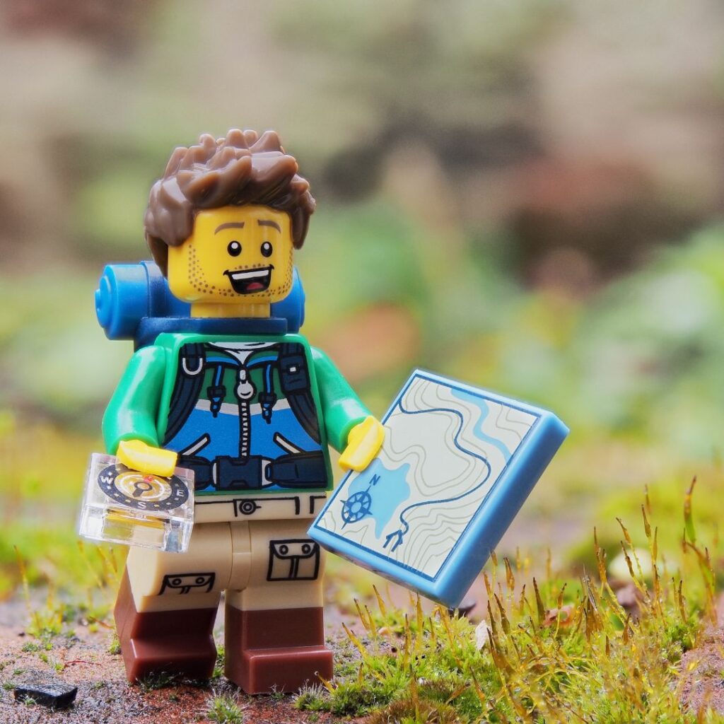 lego minifigure with map