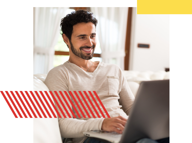 Guy standing in front of logo for Bricks & Minifigs LEGO Toy Store