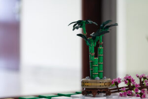 a LEGO Lucky Bamboo set next to Cherry Blossom LEGO set