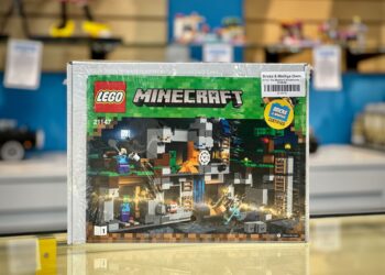 A Minecraft LEGO® set in shrink wrap on a store counter.