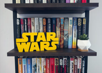 A LEGO® Star Wars™ logo on a bookshelf filled with Star Wars books.